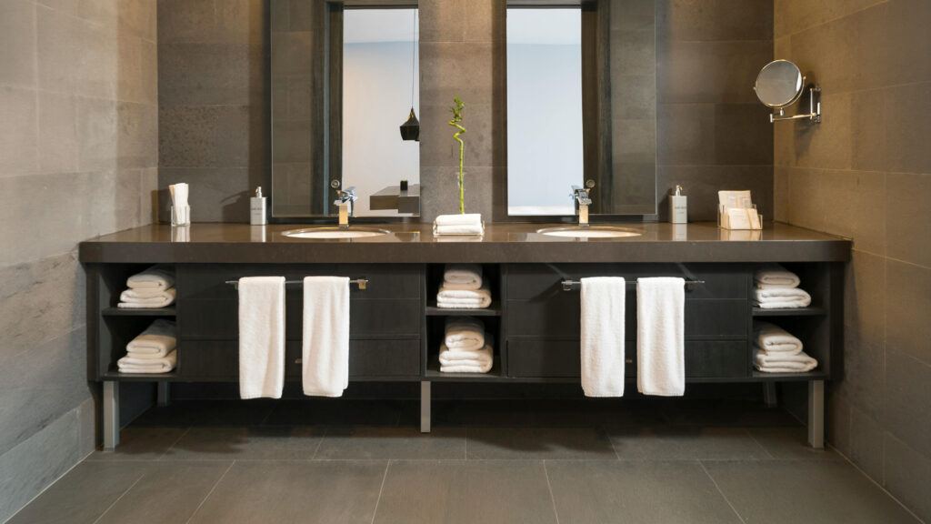 Commercial restroom with clean sinks, basins and mirrors