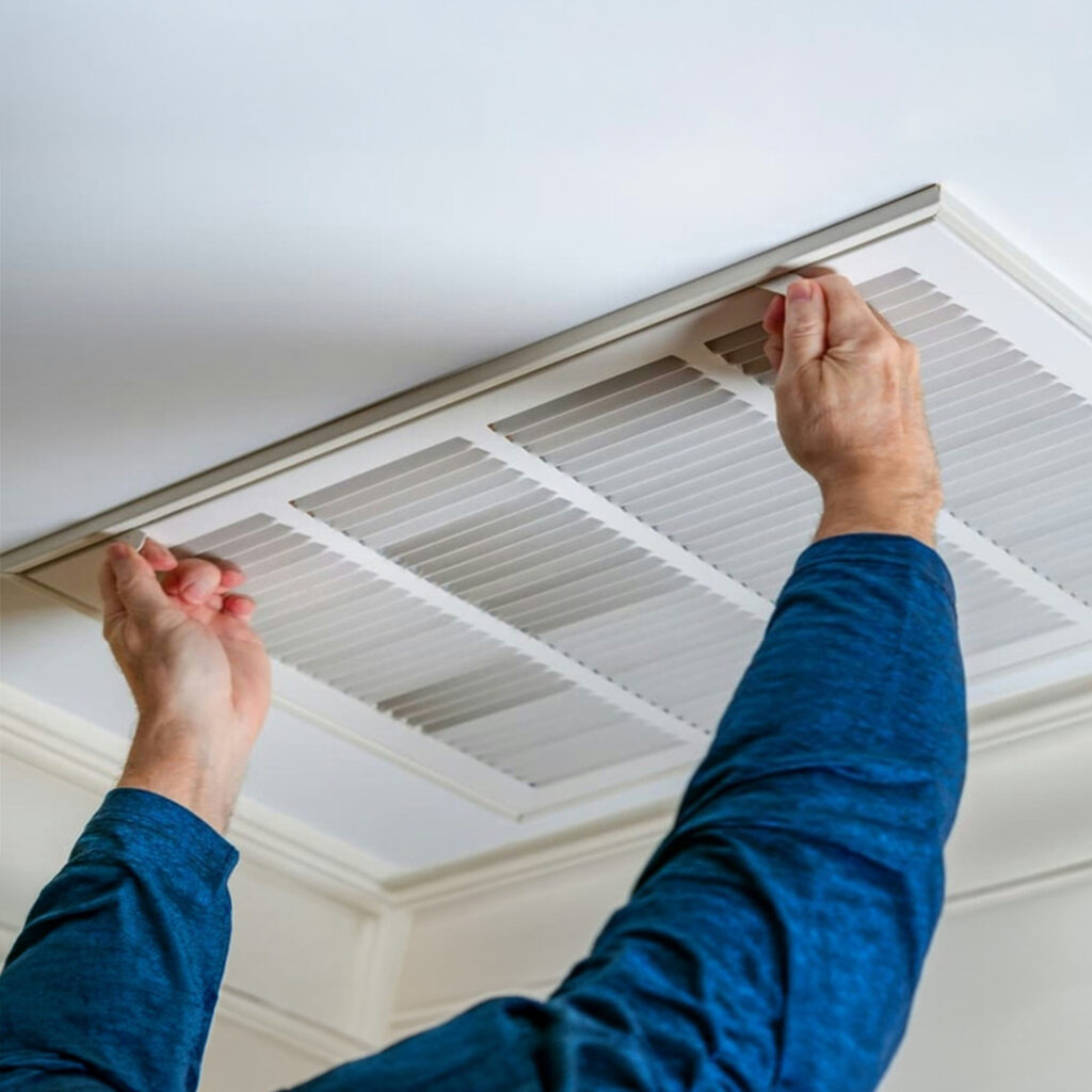 Cleaning an elevated air duct in a commercial building