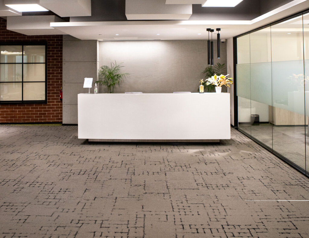 Clean carpeted reception area in a commercial office